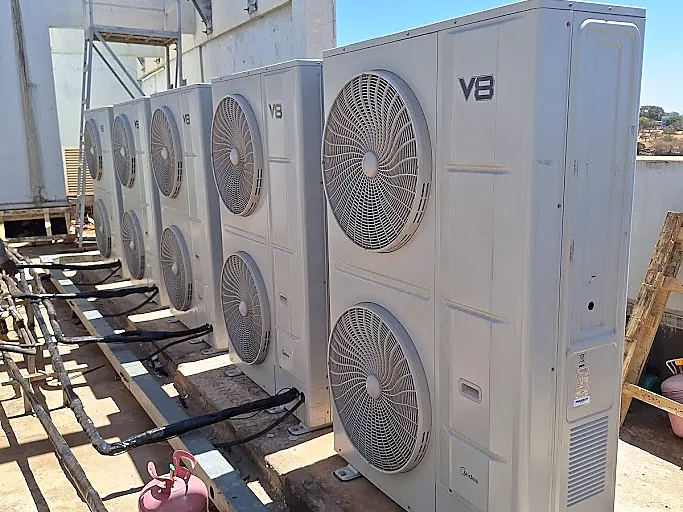 Midea VRF outdoor units installed on a rooftop